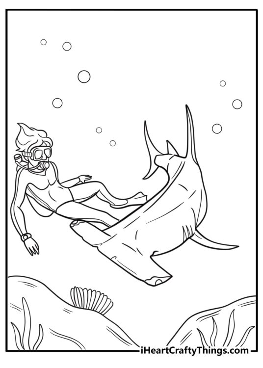 Hammerhead shark swimming past a scuba diver coloring sheet