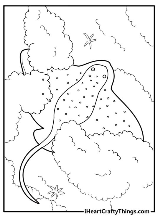 Stingray hiding beneath sand in ocean floor coloring page
