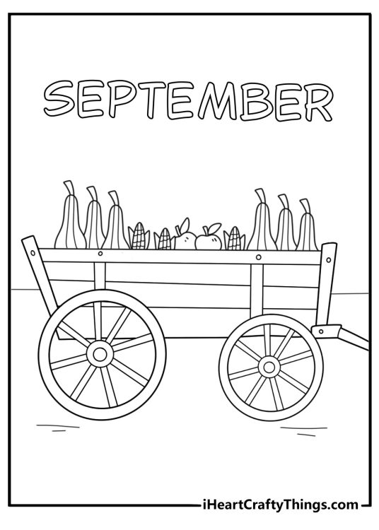 A September harvest wagon carries apples corn and gourds