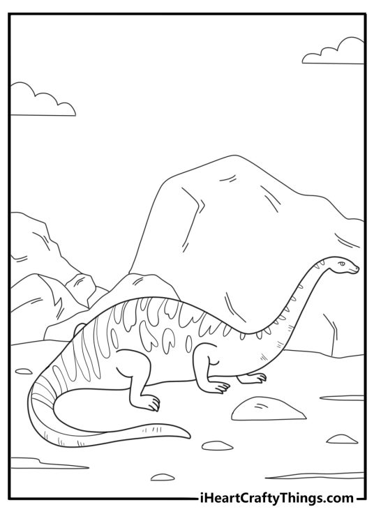 Brontosaurus resting near large rocks easy coloring page