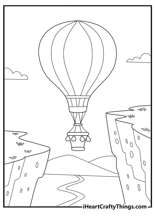 Hot air balloon in a valley between cliffs coloring page