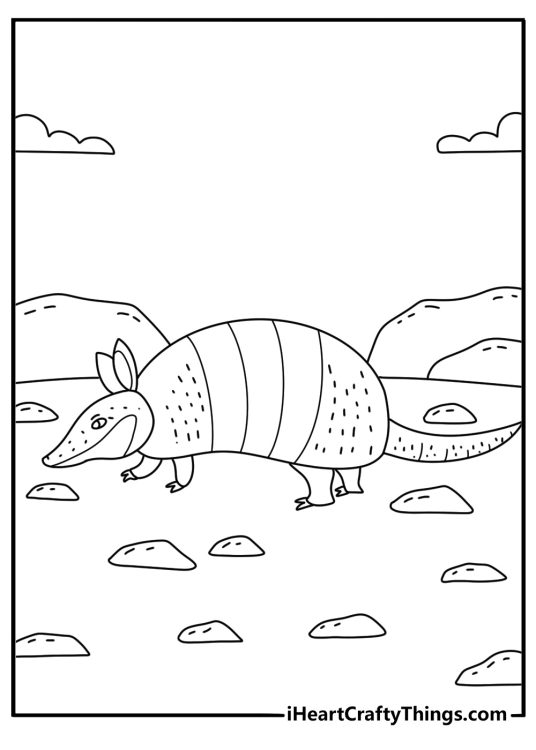 An armadillo walks across dry ground in this easy animal printable