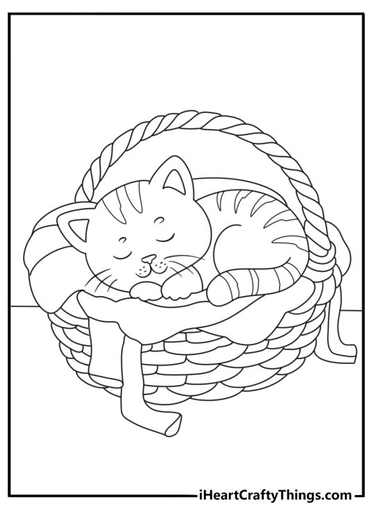 Free cat printable featuring a kitten sleeping inside a laundry basket