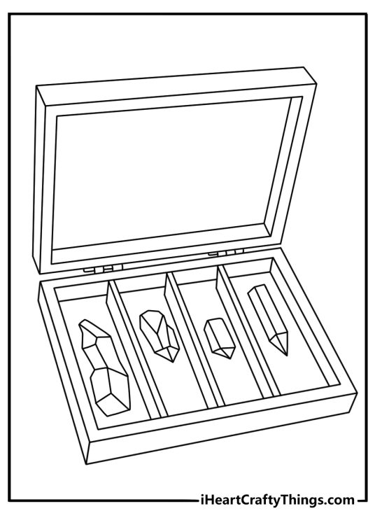 Small crystal shards rest beside a wooden display box